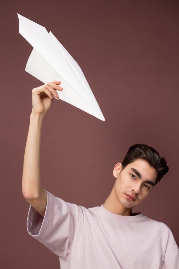 Portrait of Man with Paper Plane